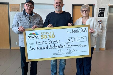 Artistic Director Alex Mustakas Presents Cheque to October 50/50 Winner Dennis Breen