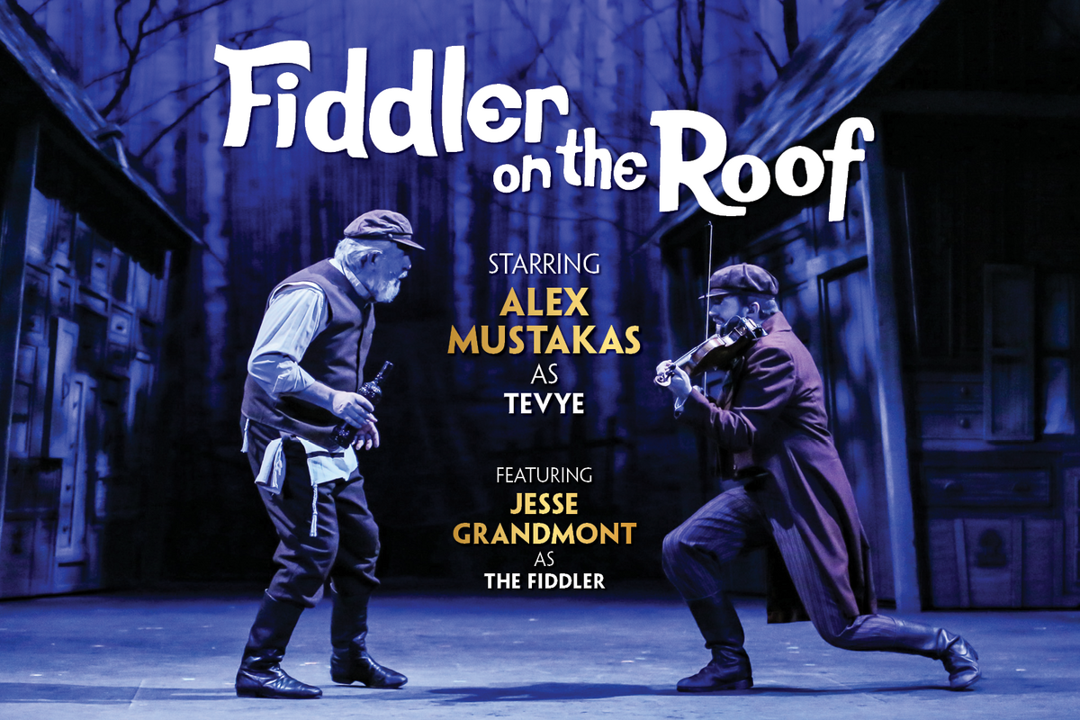 Production photo of Fiddler on the Roof showing the characters Tevye and The Fiddler dancing on stage.