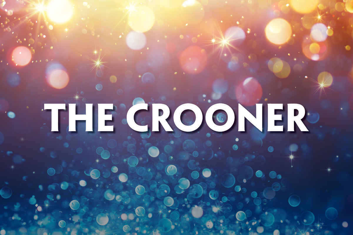 This promotional image for The Crooner features the title in bold, white letters against a sparkling bokeh background. The backdrop transitions from warm gold and pink tones at the top to cool blue hues at the bottom, creating a glamorous and vintage